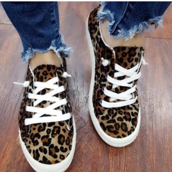 white tennis shoes with leopard